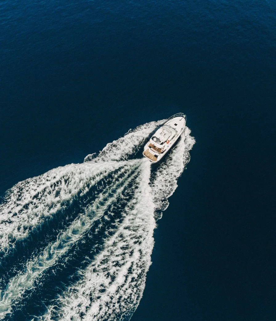 Aerial view of a YachtHampton yacht at sea, offered as a member experience through The Seagate